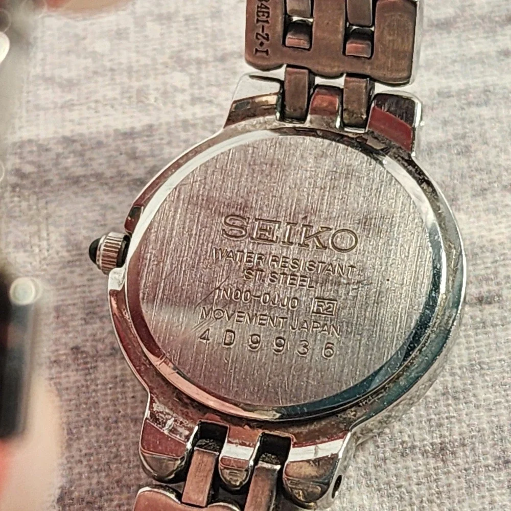 Seiko Women Watch Pink Dial Stainless Steel Rope Bezel 1N00-0JJ0 Silver Tone